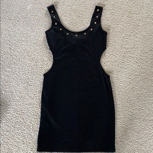 Black dress with gold studs.